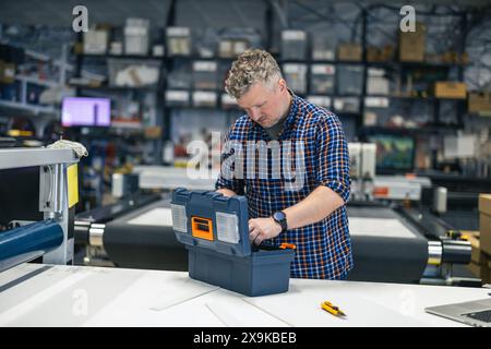 Man working in a printing factory Stock Photo