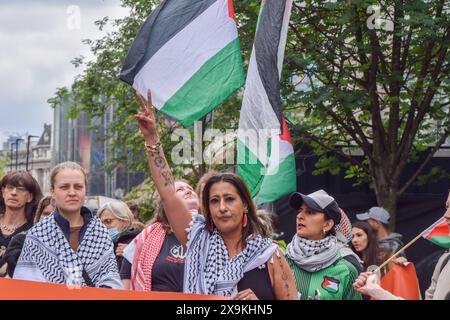 London, UK. 01st June, 2024. A protester holds up two fingers during the demonstration near Waterloo Station. Activists from the group Youth Demand, marched in solidarity with Palestine as Israel continues its attacks on Gaza. (Photo by Vuk Valcic/SOPA Images/Sipa USA) Credit: Sipa USA/Alamy Live News Stock Photo