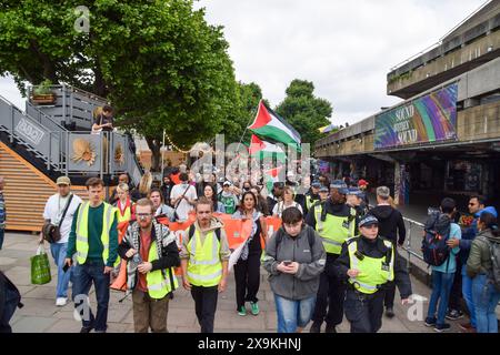 London, UK. 01st June, 2024. Protesters holding Palestinian flags pass by Southbank Centre during the demonstration. Activists from the group Youth Demand, marched in solidarity with Palestine as Israel continues its attacks on Gaza. (Photo by Vuk Valcic/SOPA Images/Sipa USA) Credit: Sipa USA/Alamy Live News Stock Photo