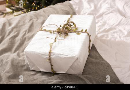 Christmas gift boxes wrapped in paper with twine string. Holiday presents, eco friendly, modern handmade design. Merry Christmas, New Year package, fe Stock Photo