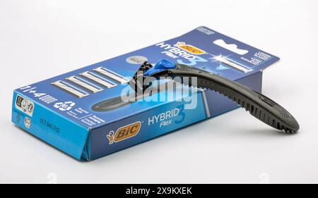 Kyiv, Ukraine - March 29, 2024: Studio shoot of Bic Hybrid Flex shaving razors machine with replaceable cassette blades closeup on white. Bic produces Stock Photo
