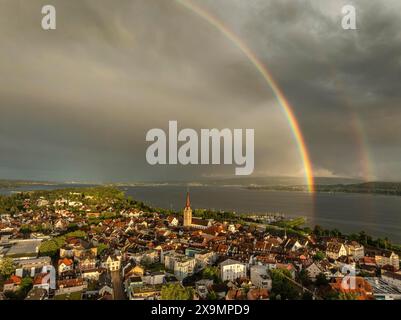 Aerial view of the town of Radolfzell on Lake Constance in front of sunset, with a double rainbow after a heavy rainstorm, thunderstorm Stock Photo