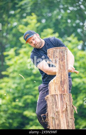 SHEPTON MALLET, SOMERSET, UK. 1st June, 2024,   Dorset Axemen displaying their wood cutting and wood chopping skills to the crowds at the Royal Bath and West Show 2024. Credit John Rose/Alamy Live News Stock Photo