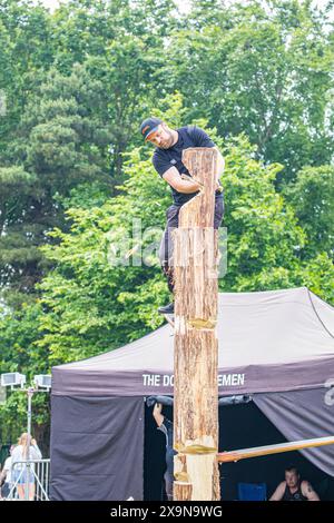 SHEPTON MALLET, SOMERSET, UK. 1st June, 2024,   Dorset Axemen displaying their wood cutting and wood chopping skills to the crowds at the Royal Bath and West Show 2024. Credit John Rose/Alamy Live News Stock Photo