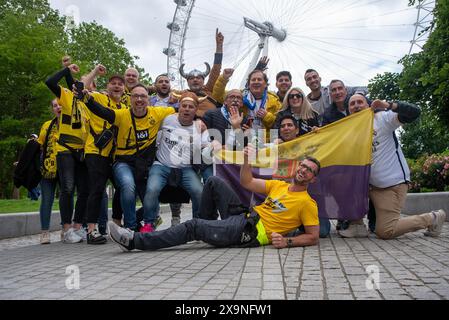 London, UK. 01st June, 2024. Borussia Dortmund and Real Madrid fans pose together front of the London Eye in London, UK. Hundreds of thousands of Borussia Dortmund and Real Madrid football or soccer fans arrived to the UEFA Champions League Final to London. Credit: SOPA Images Limited/Alamy Live News Stock Photo