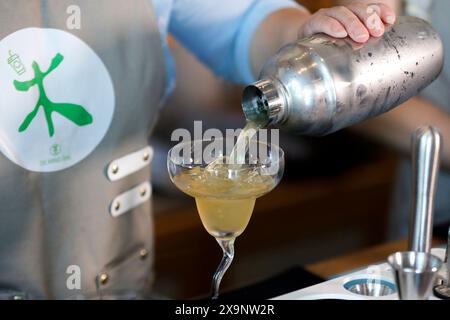 (240602) -- HUANGSHAN, June 2, 2024 (Xinhua) -- Wang Sun makes a tea beverage at Demingshe, a tea art vocational training school in Huangshan City, east China's Anhui Province, May 23, 2024. Wang Sun is the founder of Demingshe, a tea art vocational training school in Huangshan City. Huangshan City is the place of origin of several famous teas including Huangshan Maofeng, Taiping Houkui and Keemun black tea, and boasts a long history of drinking tea. As a pioneer in developing innovative tea-making skills and alternative ways of drinking tea, Wang started the research and promotion of th Stock Photo