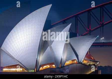 A night view featuring architectural detail of Sydney Opera House and Sydney Harbour Bridge in Sydney, New South Wales, Australia. Stock Photo