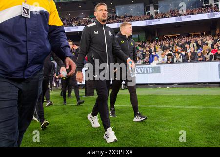 Coach, Eddie Howe (R) of Newcastle walks onto the pitch before the Exhibition match between Tottenham and Newcastle at the MCG on May 22, 2024 in Melb Stock Photo