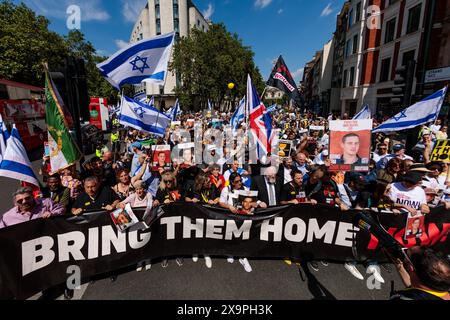 London, UK. 2nd June 2024. Thousands of people marched in London as part of the ‘Global Unity Call to Bring Hostages Home Now’, a solidarity event being held in 24 countries around the world, uniting to demand the immediate release of hostages. The event included a range of speakers, including family members of some of the 125 hostages still held captive, and musical performances by Israeli artists. 1,200 Israelis were brutally murdered and 240 hostages were taken when Hamas invaded Israel on 7th Oct 2023. Credit: Amanda Rose/Alamy Live News Stock Photo