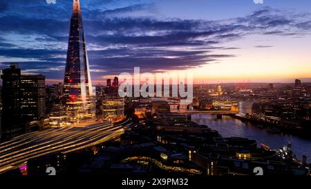 City of London after sunset - aerial view - LONDON, UNITED KINGDOM - MAY 26, 2024  Stock Photo