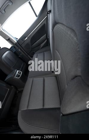 Soft black textile rear car seat with isolated windows above view Stock Photo