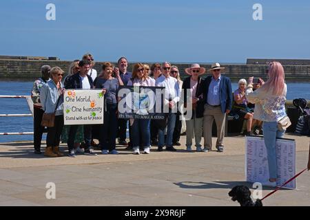 William Roache getting pictures taken with peace protesters on Whitby harbour Stock Photo