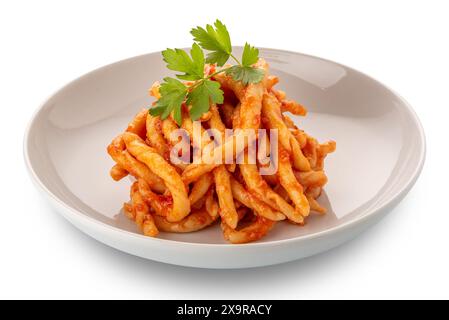 Macaroni al Ferro typical macaroni of calabrese cuisine, italy, seasoned with tomato sauce with parsley leaves, cutout, clipping path Stock Photo