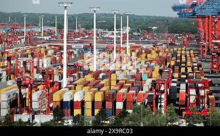 Hamburg, Germany. 13th May, 2024. Containers are handled at Eurogate's container terminal in the port of Hamburg. Credit: Christian Charisius/dpa/Alamy Live News Stock Photo