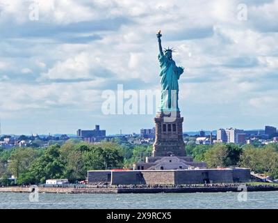 View of the Statue of Liberty lighthouse and Liberty Island from the Brooklyn cruise terminal area -02 Stock Photo