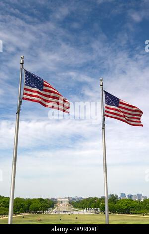 Washington DC, USA - 2 May 2024: National flag of the United States of America, the Stars and Stripes, with the Lincoln Memorial in the background Stock Photo