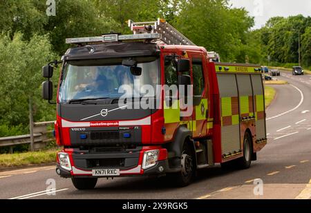 Milton Keynes,UK - May 27th 2024: Buckinghamshire Fire and Rescue Service fire engine driving on a British road Stock Photo