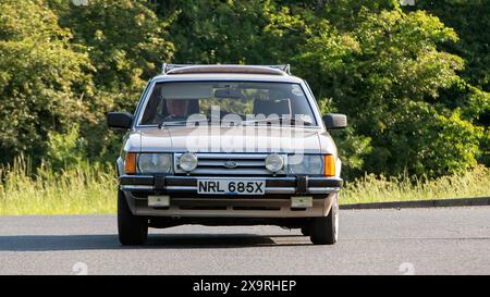 Stony Stratford,UK - June 2nd 2024: 1982 beige Ford Granada ghia estate car driving on a British country road Stock Photo