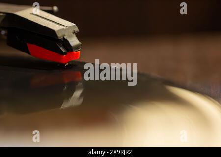 vinyl record with clear sound tracks and stylus, focus on sound tracks records, old style, classic music concept Stock Photo