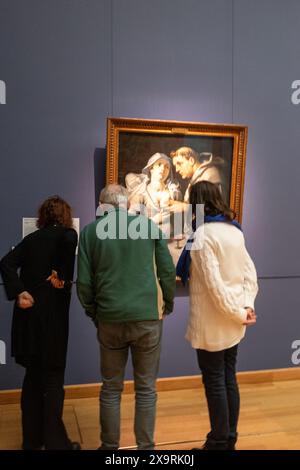 visitors looking at 'a monk and a beguine', painting of Cornelis Cornelisz van Haarlem in museum in Haarlem, Holland Stock Photo