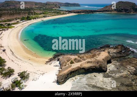 Drone view of a sheltered tropical beach and warm ocean during the dry season (Tanjung Aan, Lombok, Indonesia) Stock Photo