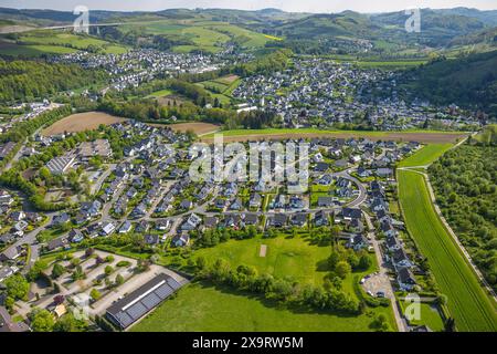 Aerial view, residential area Bestwig, Ostwig and Nuttlar with highway A46 valley bridge Nuttlar, in front parking lots and vocational college Bergklo Stock Photo