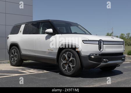 Indianapolis - May 30, 2024: Rivian R1S SUV display. Rivian offers the R1S in Adventure, Adventure All-Terrain and Launch editions. MY:2023 Stock Photo