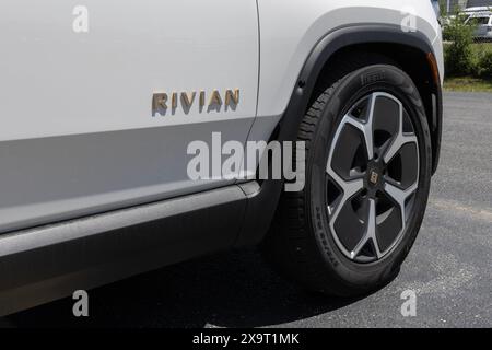 Indianapolis - May 30, 2024: Rivian R1S SUV display. Rivian offers the R1S in Adventure, Adventure All-Terrain and Launch editions. MY:2023 Stock Photo