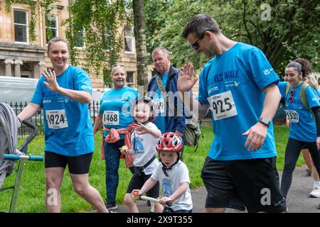 Glasgow, Scotland, UK. 2nd June, 2024. Diabetes UK's Wellness Walk through Glasgow involving many volunteers raising funds for people affected by diabetes. The 8 mile route started and ended in Kelvingrove Park taking in many landmarks through the city on the way. Credit: R.Gass/Alamy Live News Stock Photo