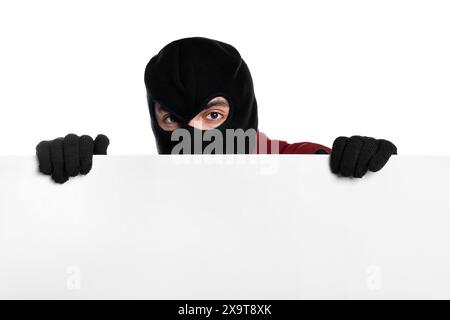 Thief in balaclava and gloves on white background Stock Photo