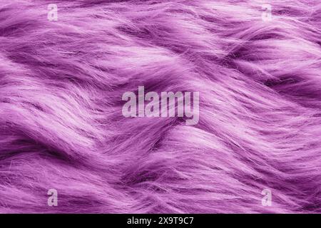 Texture of purple faux fur as background, closeup Stock Photo