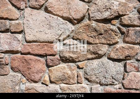 Various types of stone as a building material, stone wall, format-filling Stock Photo