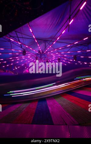 Spinning ride light trails at the Los Angeles County Fair- 23 May 2024 - Los Angeles, California - United States Stock Photo