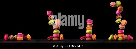 Heap of french colorful macaroon on wooden table isolated on black background with clipping path Stock Photo