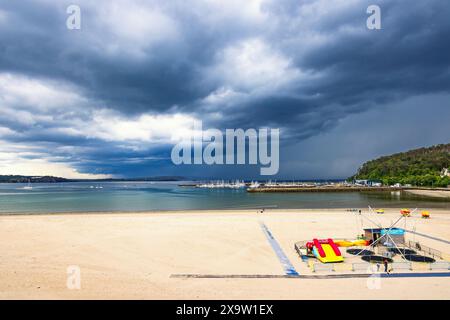 Thunderclouds over the sea at a sandy beach at Morgat in France Stock Photo