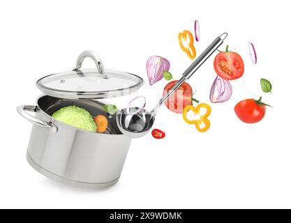 Fresh ingredients falling into saucepan on white background Stock Photo