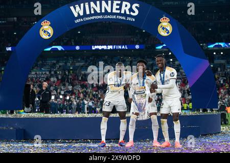 LONDON, ENGLAND - JUNE 1: Ferland Mendy, Aurelien Tchouameni and Eduardo Camavinga of Real Madrid celebrate with UEFA Champions League trophy after wi Stock Photo