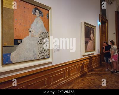 Wien, Austria - July 28, 2023: museum exhibits of Gustav Klimt of Belvedere Palace interior decorations. Baroque palace. Visitors in museum rooms of P Stock Photo