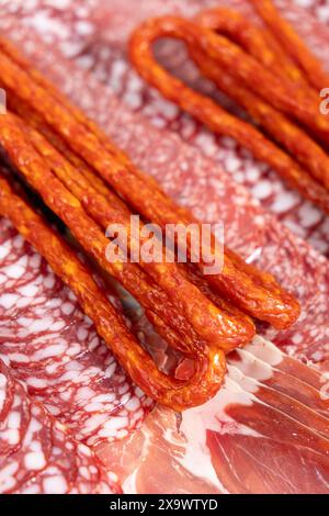 Various cold meat appetizers - Spanish ham cerrato, salami, sausages Stock Photo