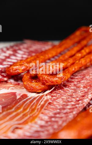 Various cold meat appetizers - Spanish ham cerrato, salami, sausages Stock Photo