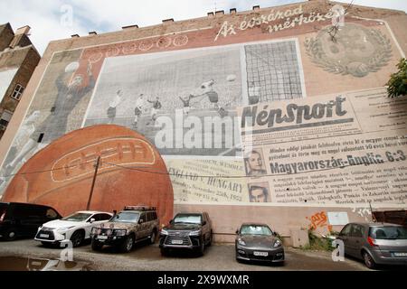 A mural entitled “6:3” depicts the victory of the Aranycsapat (“Golden Team”) over England at Wembley in November 1953. The “Match of the Century” was the first home defeat for England of any continental side, and was in many ways a watershed for English football, tactically, especially when in a return fixture in Budapest six months later the Golden Team dispatched an England team featuring Billy Wright and Tom Finney 7-1 in front of around 100,000 people. Stock Photo