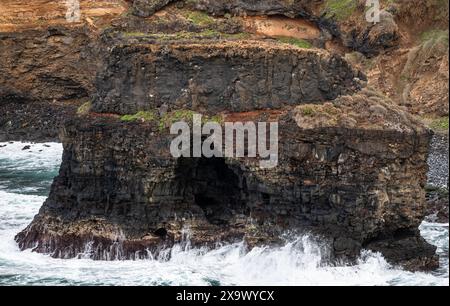 Roque Chico sea arch, an excellent example of coastal erosion by wave action from Rambla de Castro walking path near Puerto de la Cruz, Tenerife Stock Photo