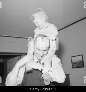 Current 12- 1945: Norway's youngest minister, milorg chief Hauge. Here at the home of Defense Minister Jens Chr. Hauge in Professor Dahlsgate. Jens Christian Jr. takes a ride on father's neck.Photo: Th. Skotaam / Aktuell / NTB ***Photo is not image processed*** Stock Photo