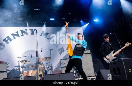 Singer songwriter and guitarist and former member of The Smiths Johnny Marr playing a live gig at The Piece Hall in Halifax. Stock Photo