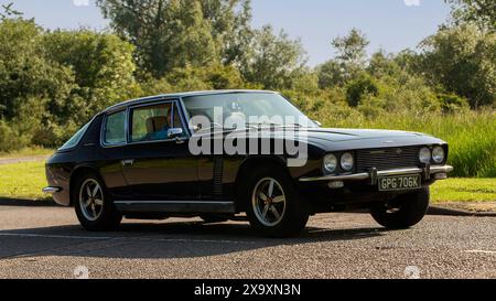 Stony Stratford,UK - June 2nd 2024: 1971 Jensen Interceptor classic car driving on a British country road Stock Photo