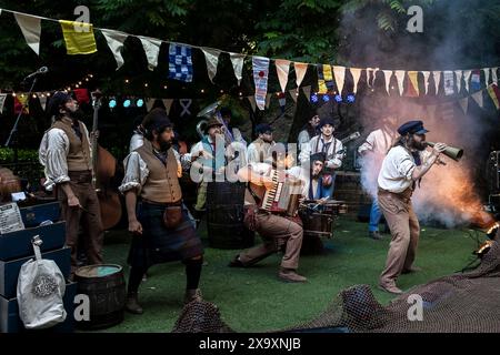 The Old Time Sailors performing at Trebah Garden Amphitheatre in Cornwall. Stock Photo