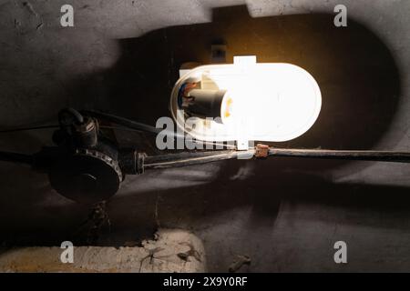 Emergency lighting in a military storage. Lighting in the old basement. Stock Photo