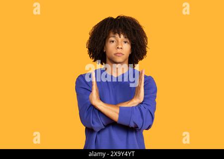 Man Standing With Hands Folded in Front Stock Photo