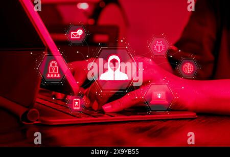 Cyberattack, cybercrime, data system hacking and fraud and security attack concepts. Hacker and scam icons show virtual screen while person working wi Stock Photo