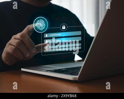 Digital fingerprint scan icon scanning by businessman hand on login on page website virtual screen from laptop computer. Biometrics identification, cy Stock Photo